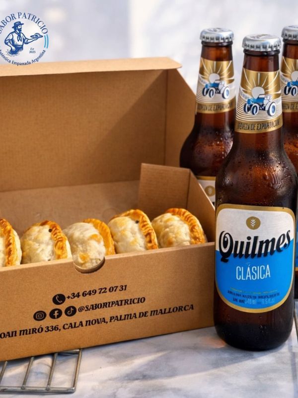 Caja de Sabor Patricio con seis empanadas y botellas de cerveza Quilmes